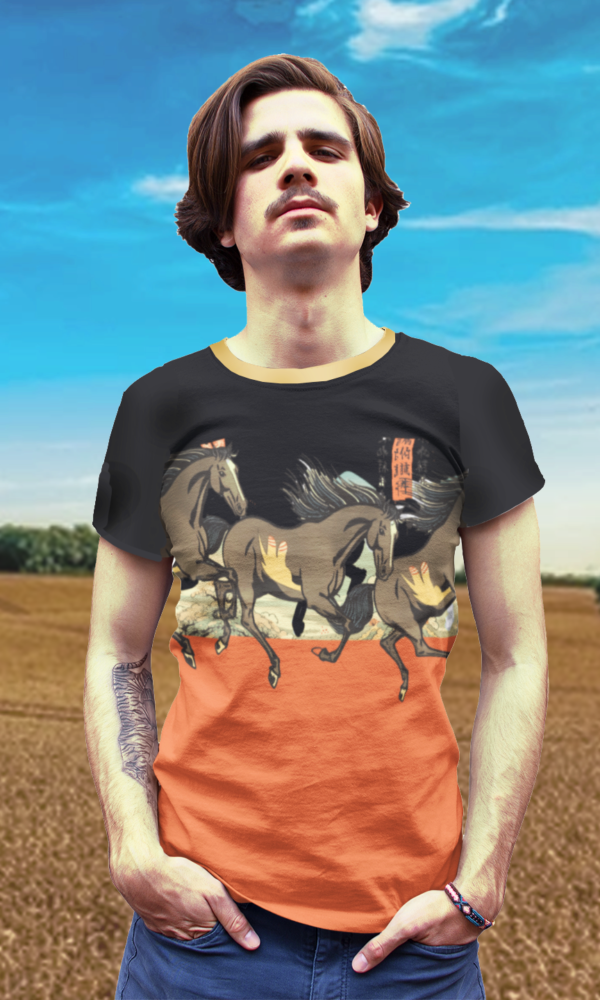 Youung man with tattoos wearing a tshirt with a chinese art all over print of galloping horses in red, black and cream, standing in front of a country field.